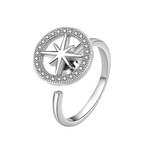 A gold-plated, hypoallergenic Star Anxiety Fidget Spinner Ring with a cubic zirconia centerpiece on a white background.