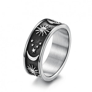 Silver celestial engraved ring with sun, moon, and stars design on a wide band