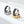 Two rings, one silver and one gold, with engraved designs on a white background