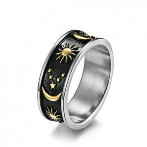 Gold celestial engraved ring with sun, moon, and stars design on a wide band