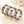 Set of four rings with celestial designs on a light background