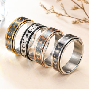 Set of four rings with celestial designs on a light background