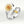 Two rings, one with a sunflower design and the other with a dragonfly and gemstone, on a light gray background.