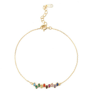 Sterling silver bracelet with gold plating and multicolored gemstone accents, displayed on a white background