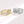 Two gold and silver rings with diamond accents on a white background