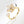 Gold ring with floral design on a light gray background